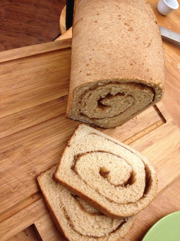 I laid down a layer of honey, sucanat, and cinnamon before rolling up the dough into a loaf.